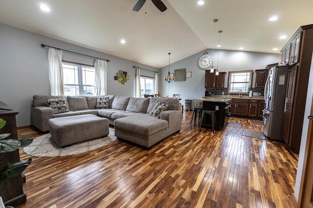351 Alyssa St, Tomah, WI 54660 - living area with dark wood-type flooring, recessed lighting, ceiling fan with notable chandelier, and vaulted ceiling
