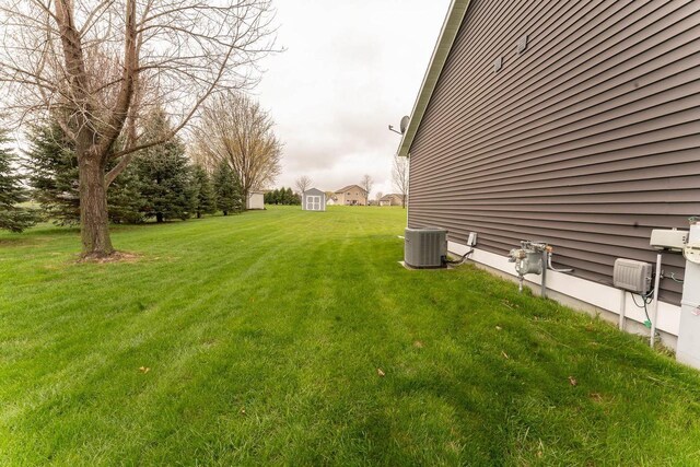 351 Alyssa St, Tomah, WI 54660 - view of yard featuring a storage shed, an outbuilding, and cooling unit
