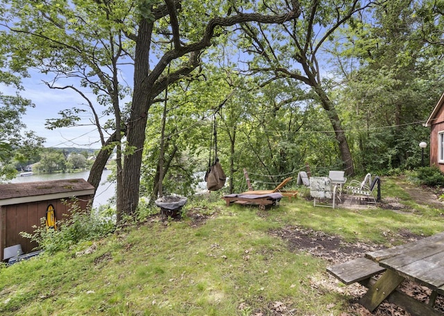 416 Waldeck Dr, Twin Lakes, WI 53181 - view of yard featuring a storage shed and an outbuilding