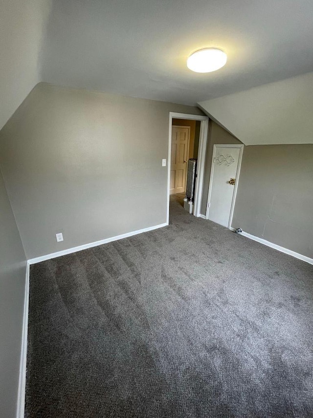 bonus room featuring baseboards, carpet flooring, and lofted ceiling