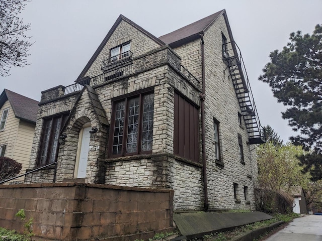 view of side of property featuring stone siding