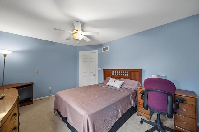 bedroom with baseboards, light carpet, a ceiling fan, and visible vents