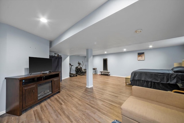 bedroom with light wood-style floors, recessed lighting, and baseboards
