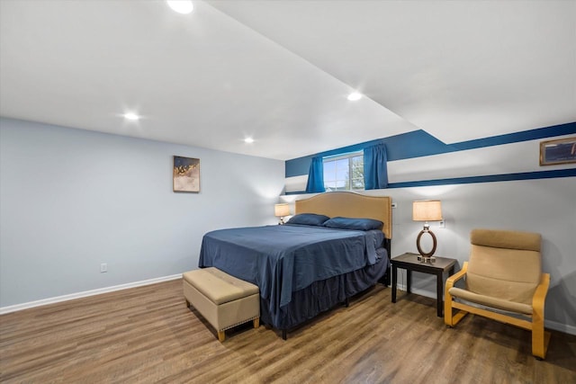 bedroom with recessed lighting, baseboards, and wood finished floors