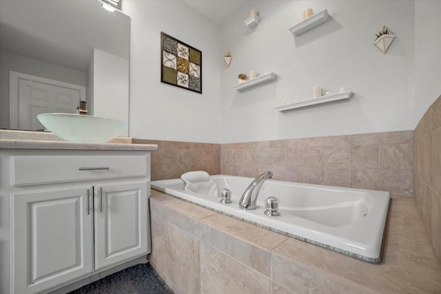 bathroom with a bath and vanity