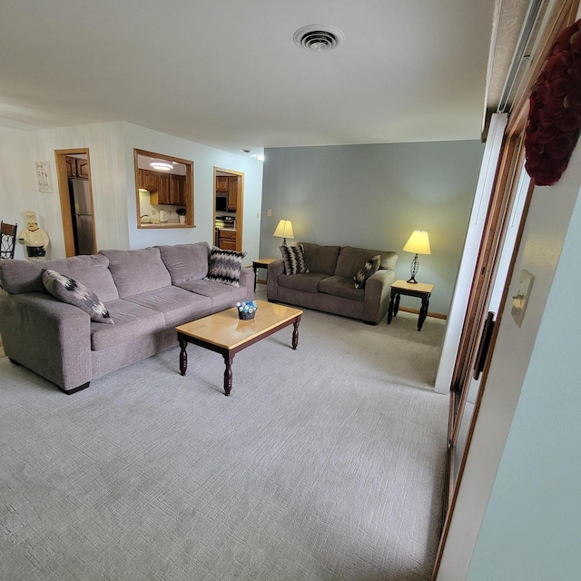 carpeted living room with visible vents