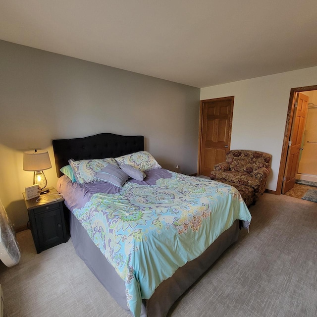 bedroom featuring light colored carpet