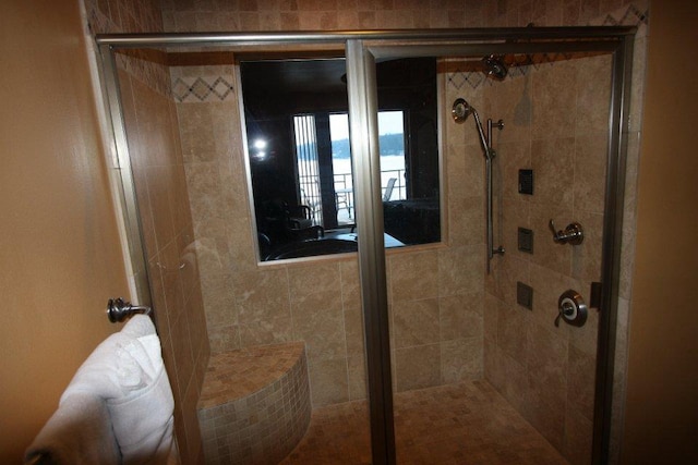 full bathroom featuring a stall shower