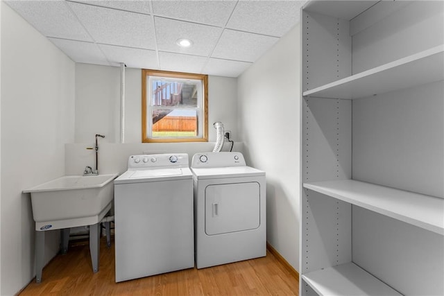 washroom featuring recessed lighting, laundry area, washer and clothes dryer, and light wood-style floors
