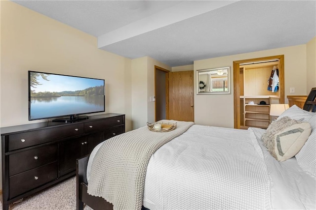 bedroom featuring light carpet