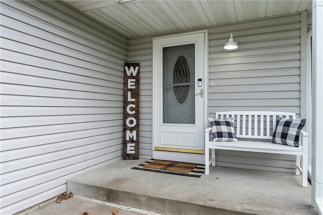 entrance to property featuring a porch