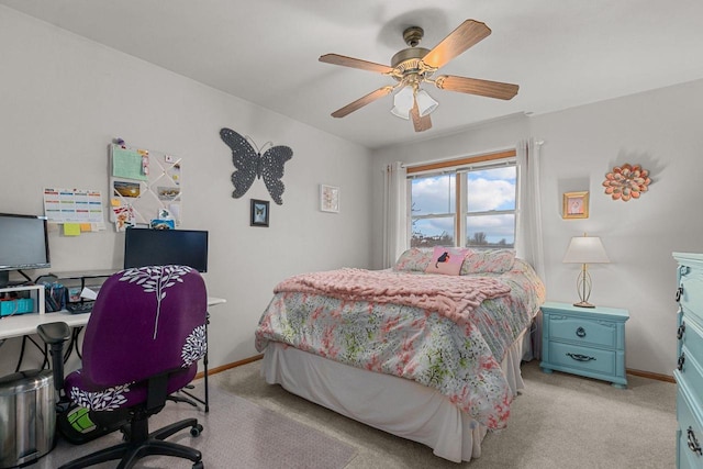 bedroom featuring baseboards, a ceiling fan, and light carpet