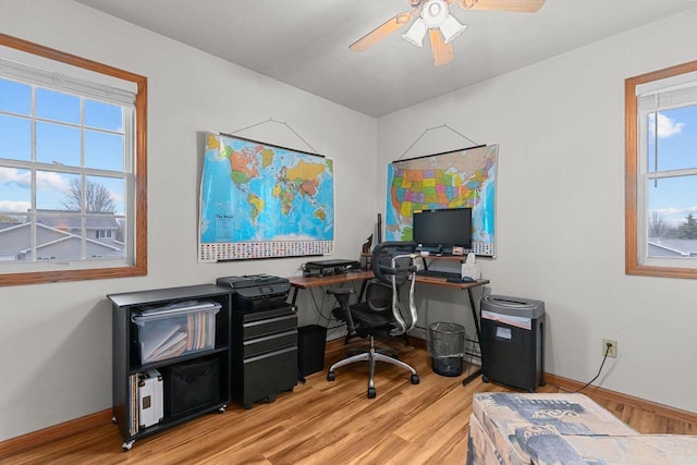 home office with baseboards, a ceiling fan, and wood finished floors