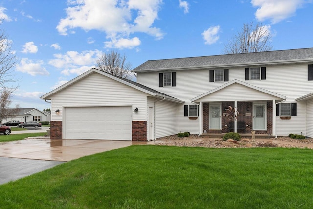 view of front of property with brick siding, an attached garage, a front yard, and concrete driveway