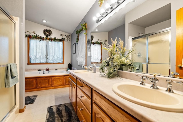 bathroom with a sink, a bath, a stall shower, and vaulted ceiling