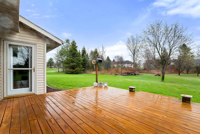 wooden deck with a lawn