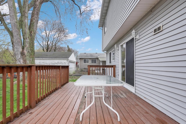 3317 E Denton Ave, Saint Francis, WI 53235 - wooden deck with an outbuilding and outdoor dining area