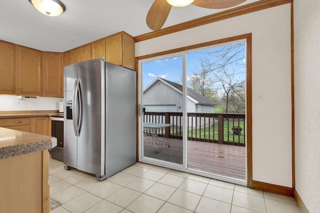 3317 E Denton Ave, Saint Francis, WI 53235 - kitchen featuring appliances with stainless steel finishes, ceiling fan, crown molding, light tile patterned floors, and baseboards