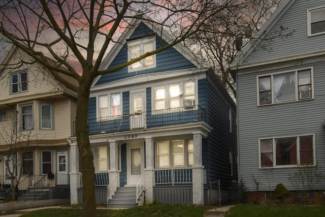view of front facade featuring a porch and a balcony