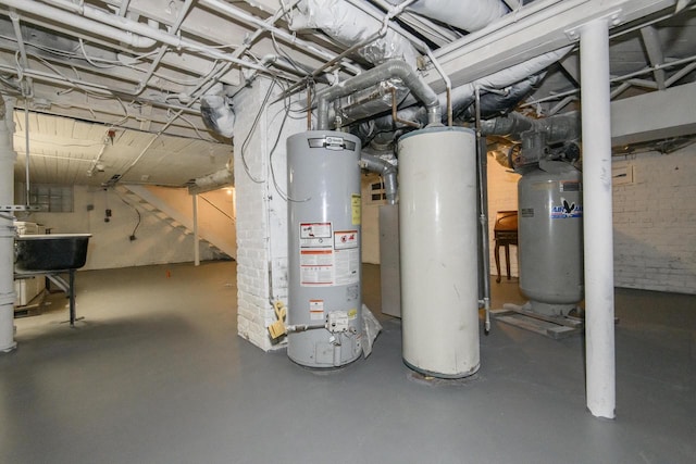 utility room featuring a sink and water heater