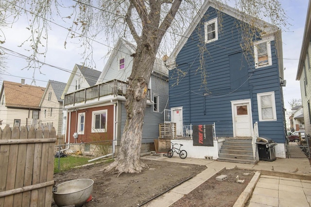 back of property with fence