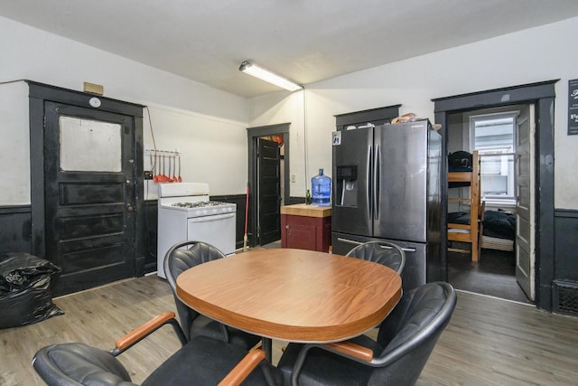 dining space featuring wood finished floors