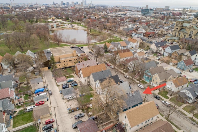 aerial view with a water view and a city view