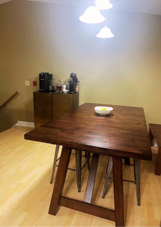 dining room with light wood-style flooring