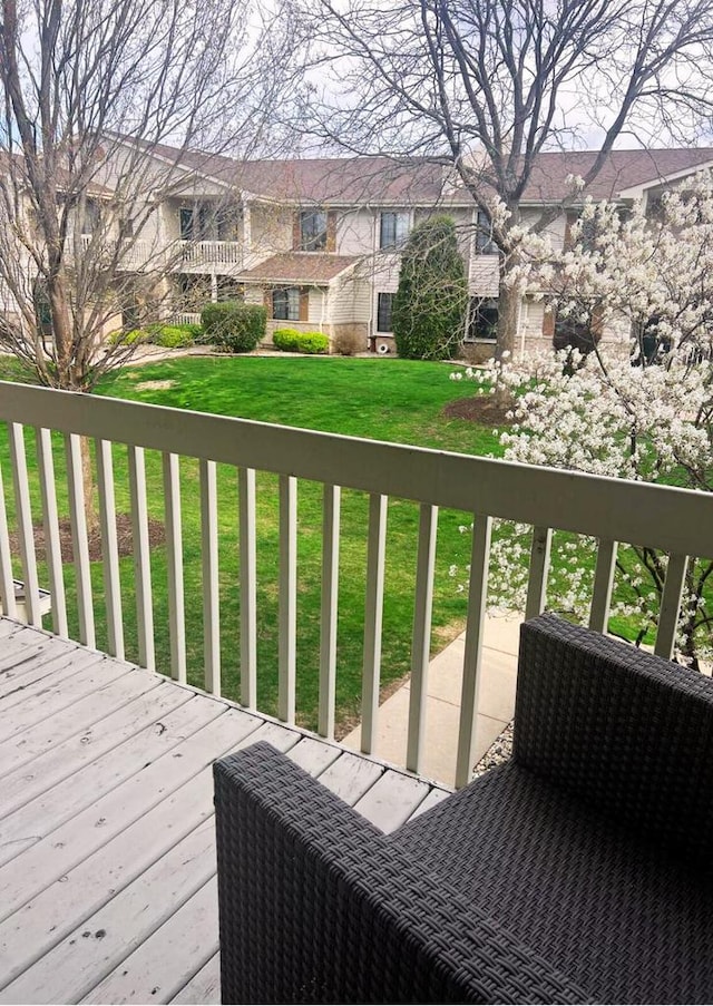 wooden deck with a yard