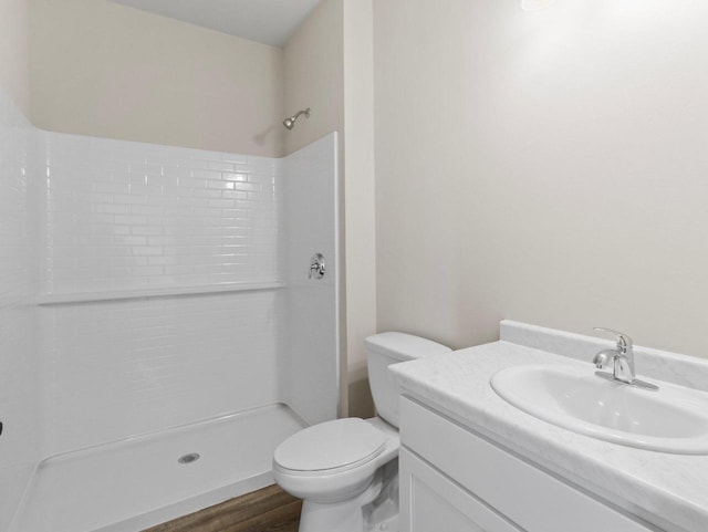 W194N16740 Eagle Dr Unit 1, Jackson, WI 53037 - full bathroom with a shower, wood finished floors, and vanity