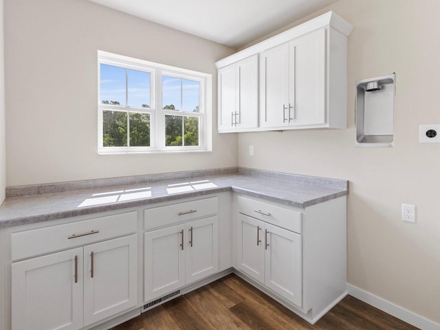 W194N16740 Eagle Dr Unit 1, Jackson, WI 53037 - kitchen featuring dark wood-type flooring, light countertops, and white cabinetry