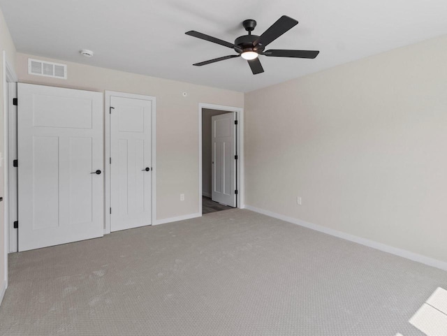 W194N16740 Eagle Dr Unit 1, Jackson, WI 53037 - unfurnished bedroom with carpet floors and a ceiling fan