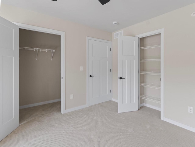 W194N16740 Eagle Dr Unit 1, Jackson, WI 53037 - unfurnished bedroom featuring a walk in closet, carpet floors, and a closet