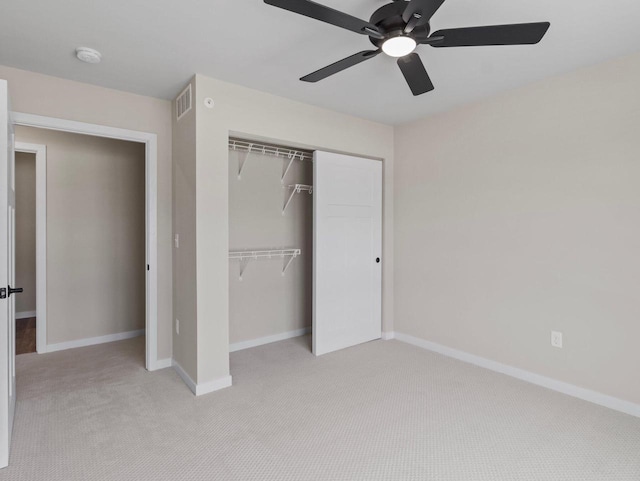 W194N16740 Eagle Dr Unit 1, Jackson, WI 53037 - unfurnished bedroom featuring light carpet, a closet, and ceiling fan