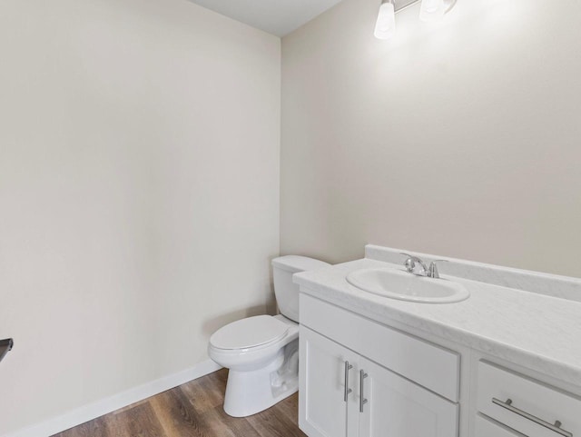 W194N16740 Eagle Dr Unit 1, Jackson, WI 53037 - half bath featuring vanity and wood finished floors