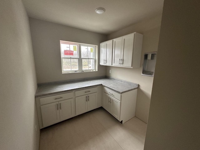 W194N16740 Eagle Dr Unit 1, Jackson, WI 53037 - kitchen featuring white cabinets and light countertops