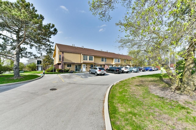view of front of property featuring uncovered parking