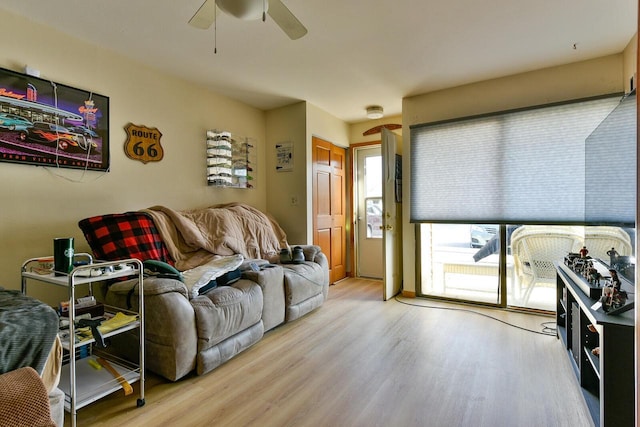 living room featuring ceiling fan and wood finished floors