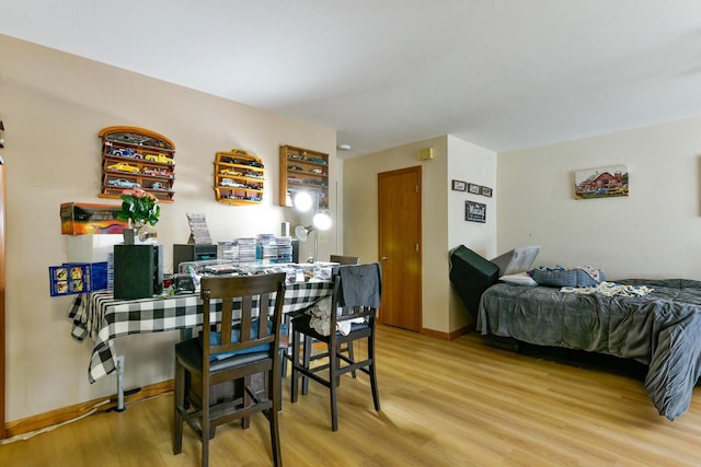 dining area with light wood-style flooring