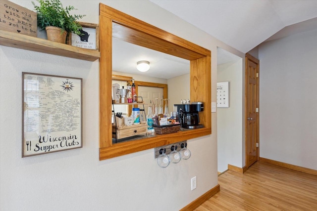 details featuring baseboards and wood finished floors