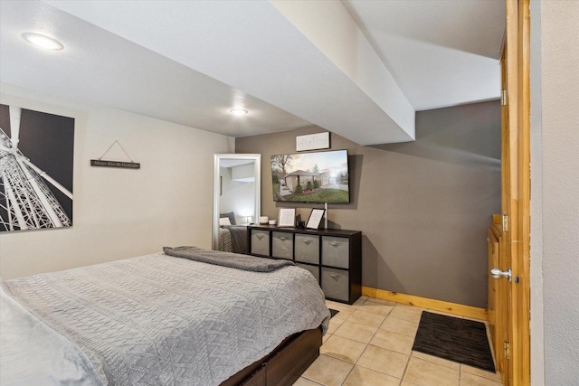 bedroom with baseboards, recessed lighting, and light tile patterned flooring