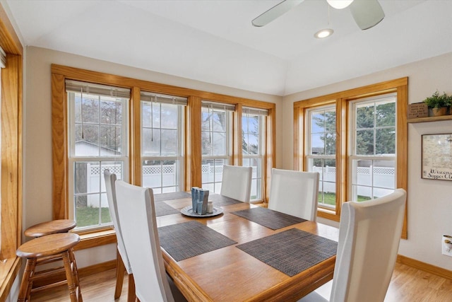 dining room with a ceiling fan, vaulted ceiling, baseboards, light wood-style floors, and recessed lighting