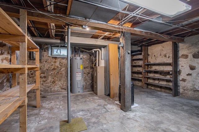 below grade area featuring water heater