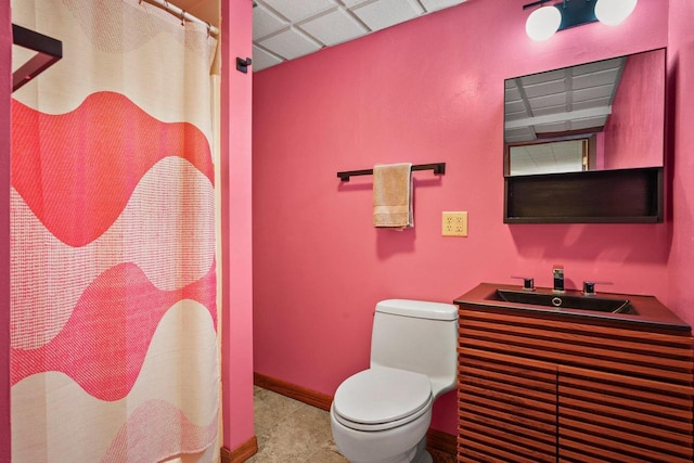 632 N Harrison St, Stoughton, WI 53589 - bathroom with toilet, a sink, a shower with shower curtain, and baseboards