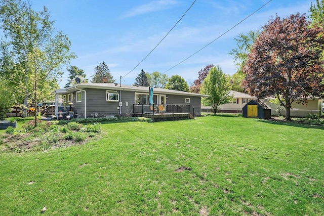 632 N Harrison St, Stoughton, WI 53589 - rear view of house with a shed, an outbuilding, and a yard