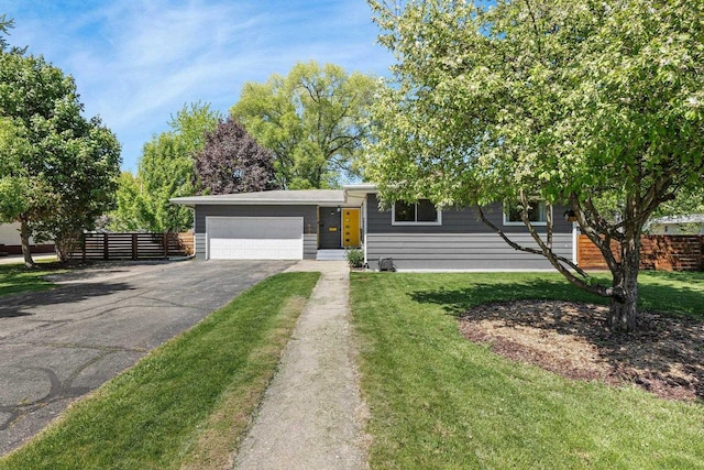 632 N Harrison St, Stoughton, WI 53589 - view of front of property featuring asphalt driveway and an attached garage