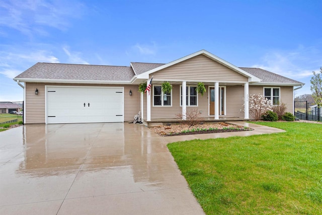ranch-style house with a garage, fence, covered porch, a front yard, and concrete driveway