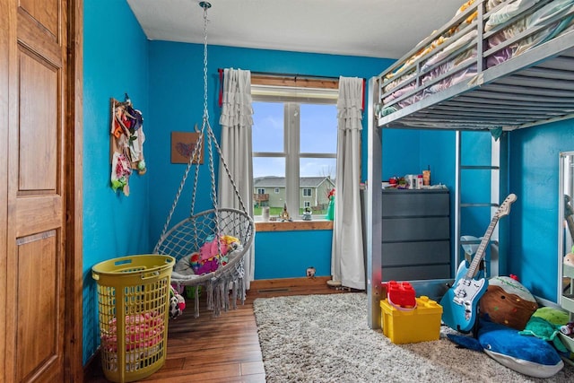 bedroom with wood finished floors