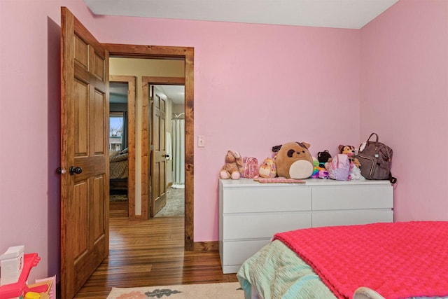 bedroom featuring wood finished floors