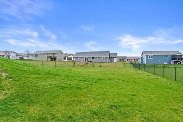 view of yard with fence and a residential view